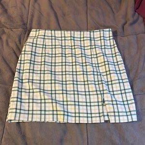 Green plaid Wild Fable skirt with small slit in front.